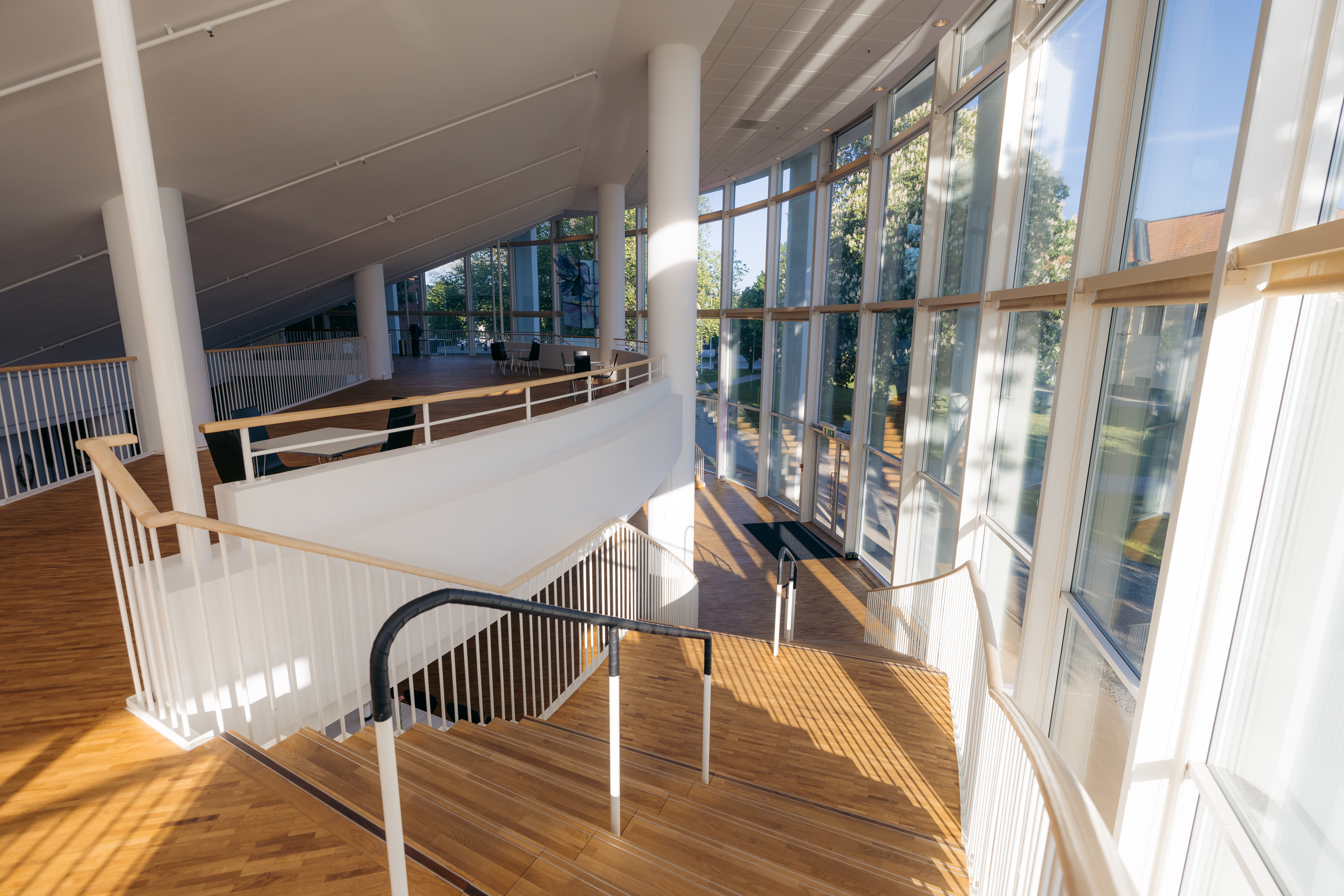 Large open room with rounded wall and large windows