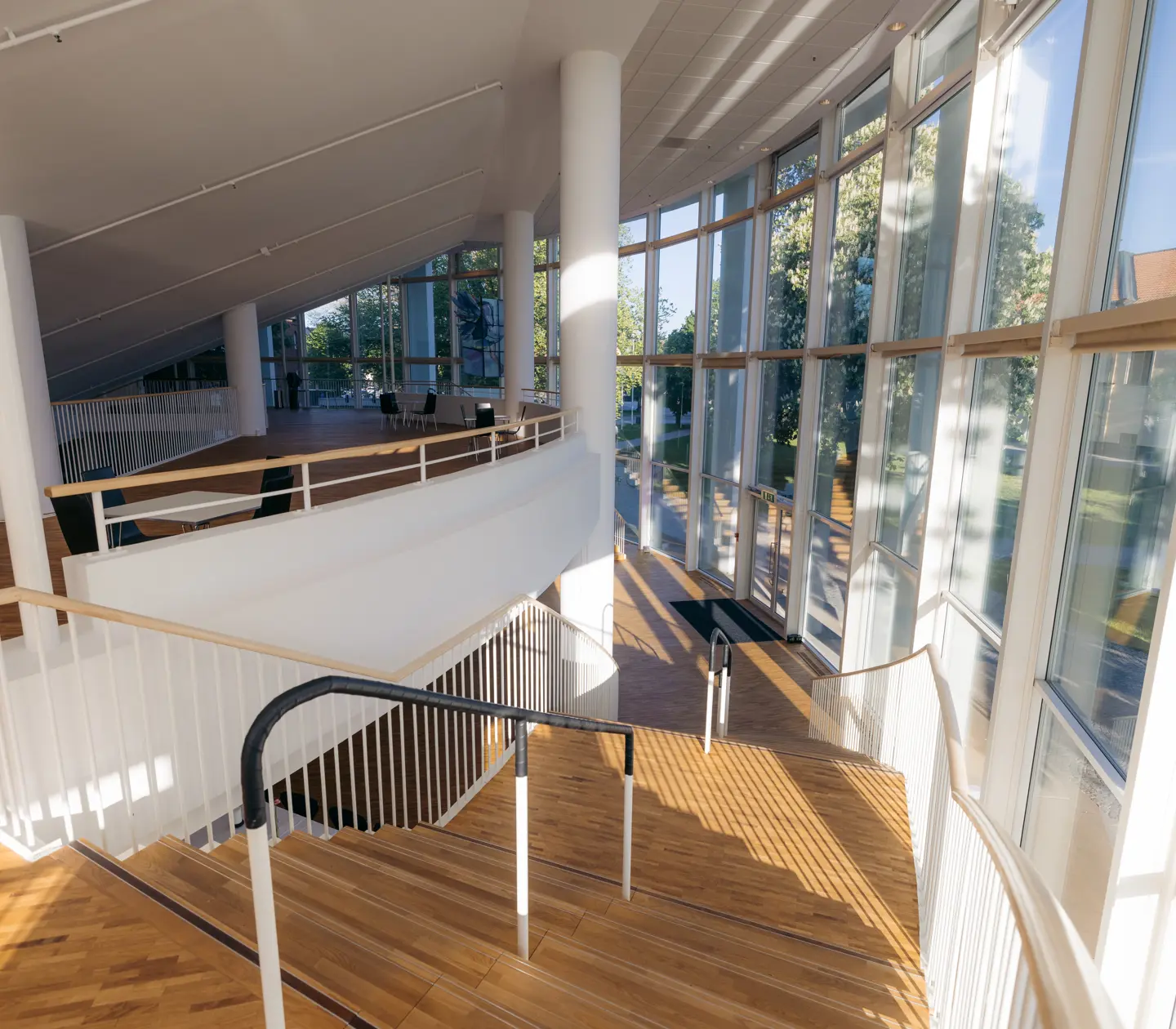 Large open room with rounded wall and large windows