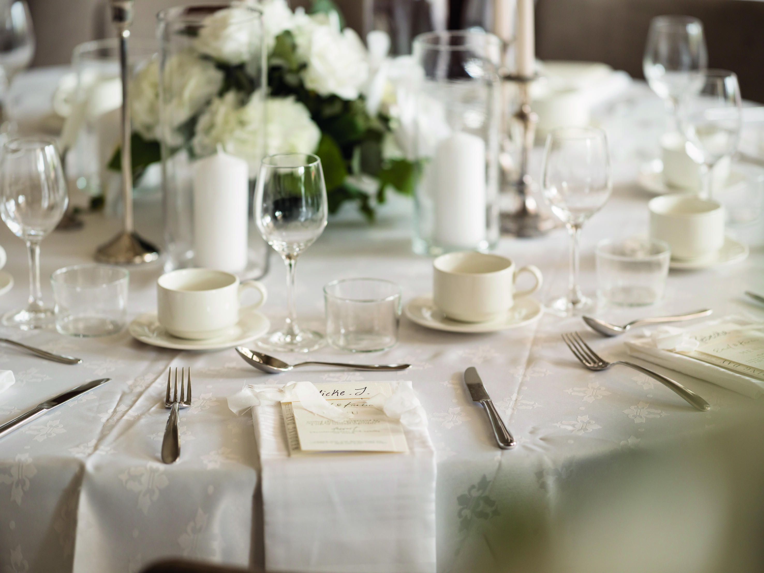 Waiter pour champagne into glasses