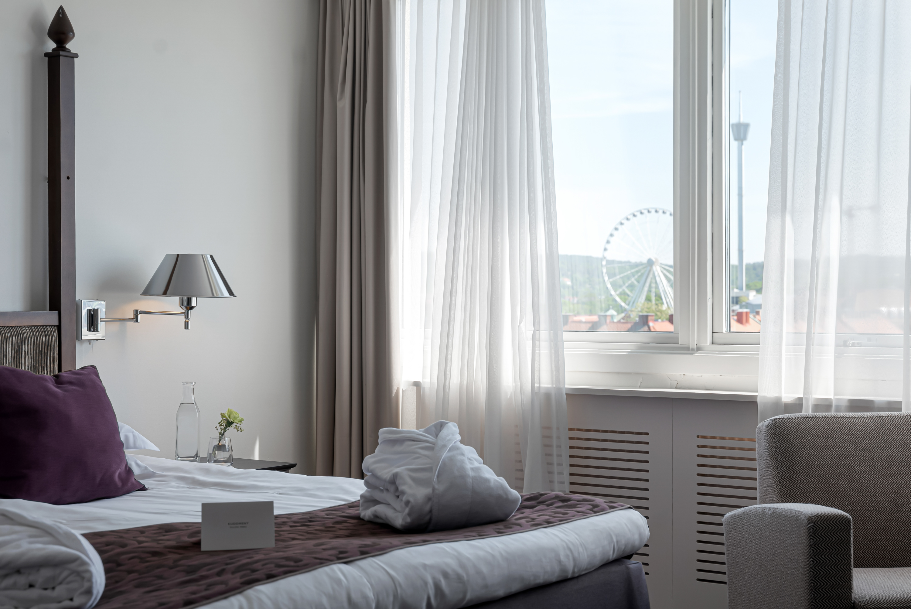 Cozy hotel room with ferris wheel outside the window