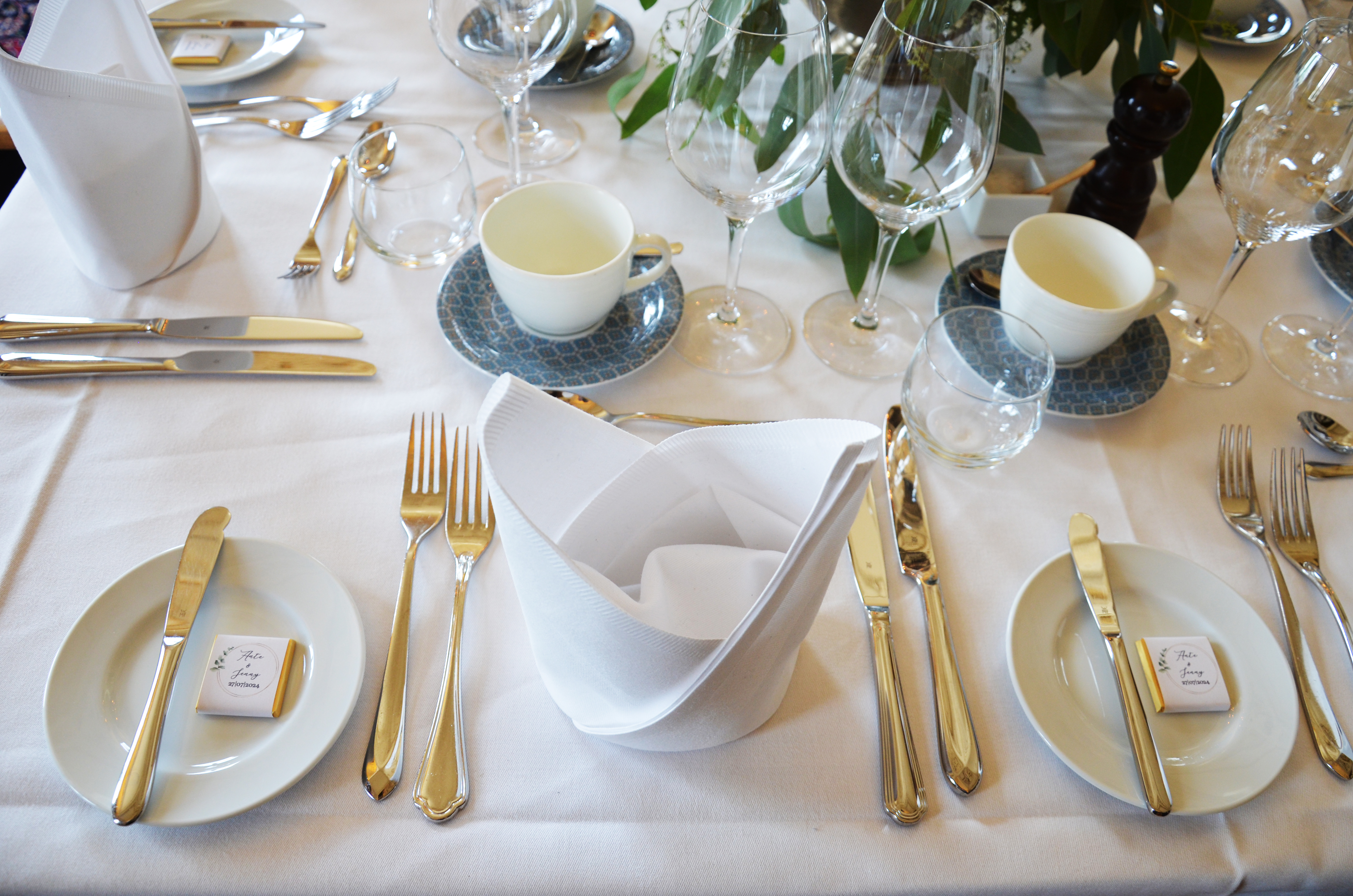 Large wedding venue with several tables and chairs in groups.