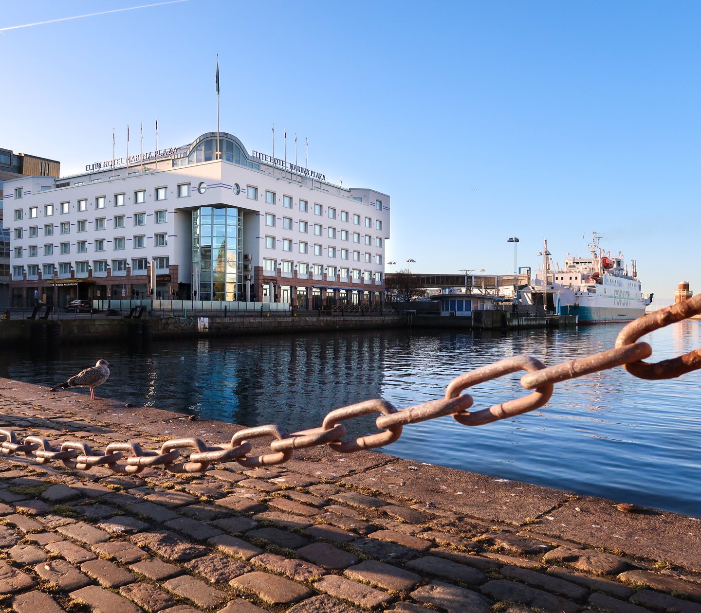 A large white building in the harbour of Helsingborg