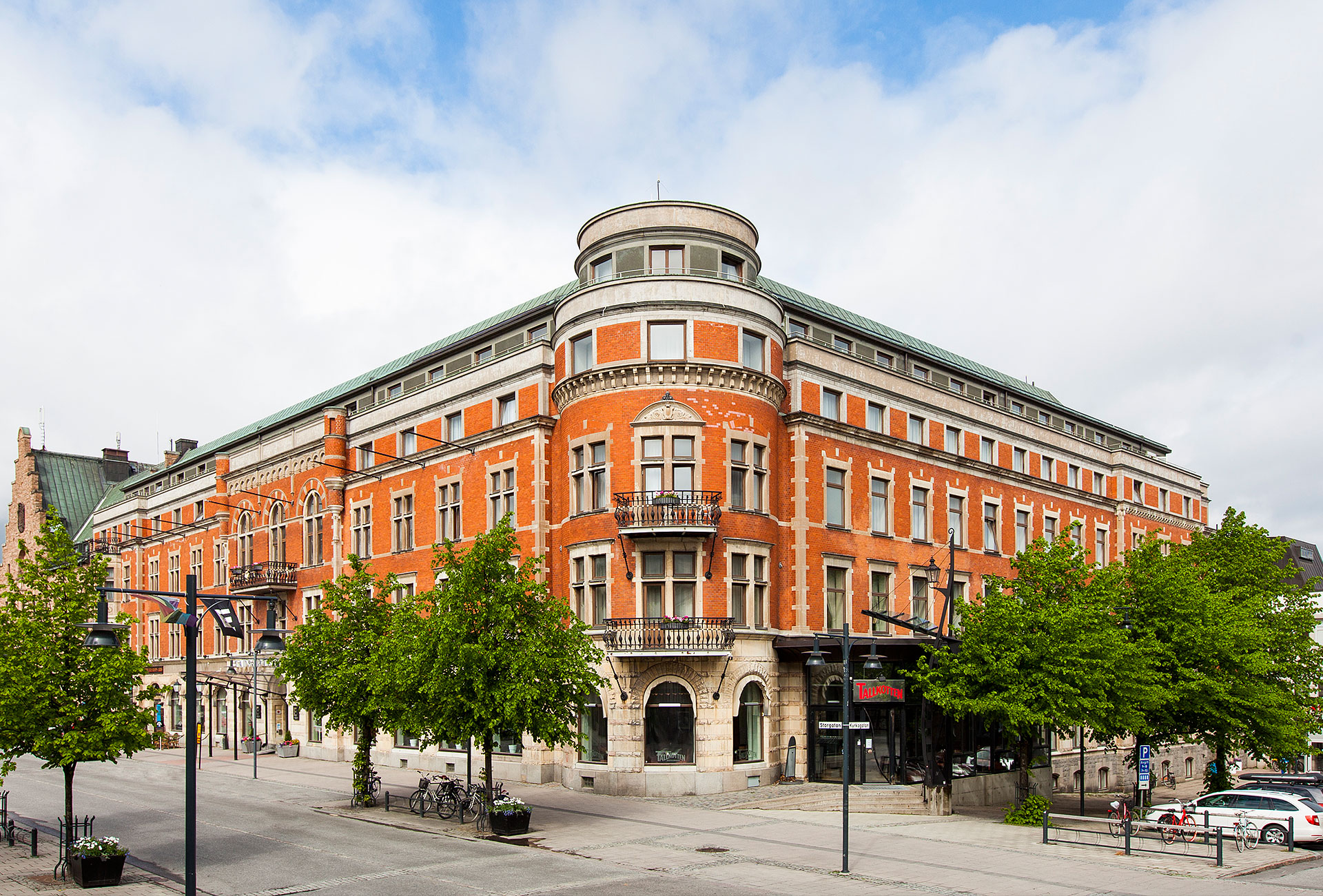 Large and beautiful orange building in a city
