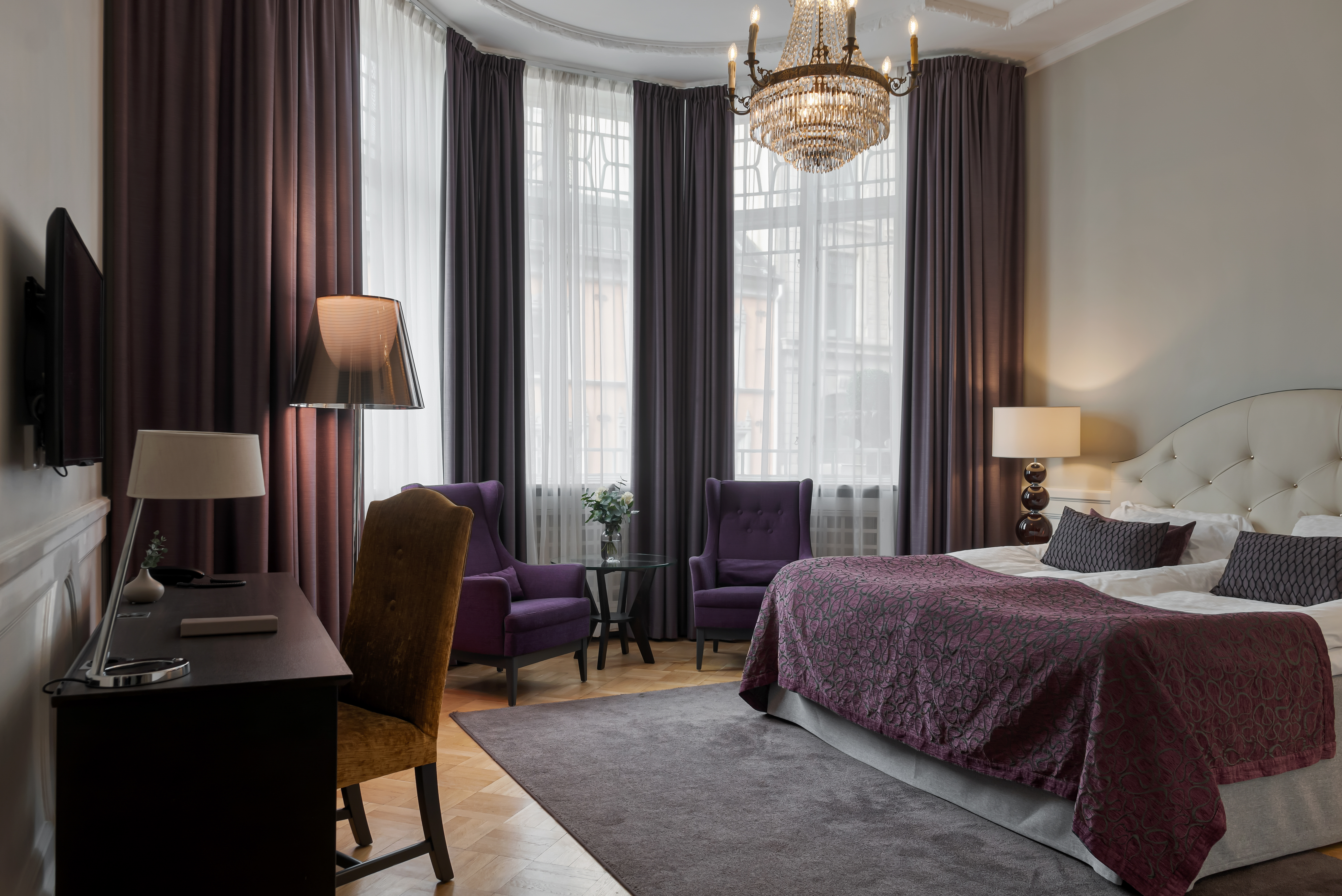 Cozy hotel room with a crystal chandelier