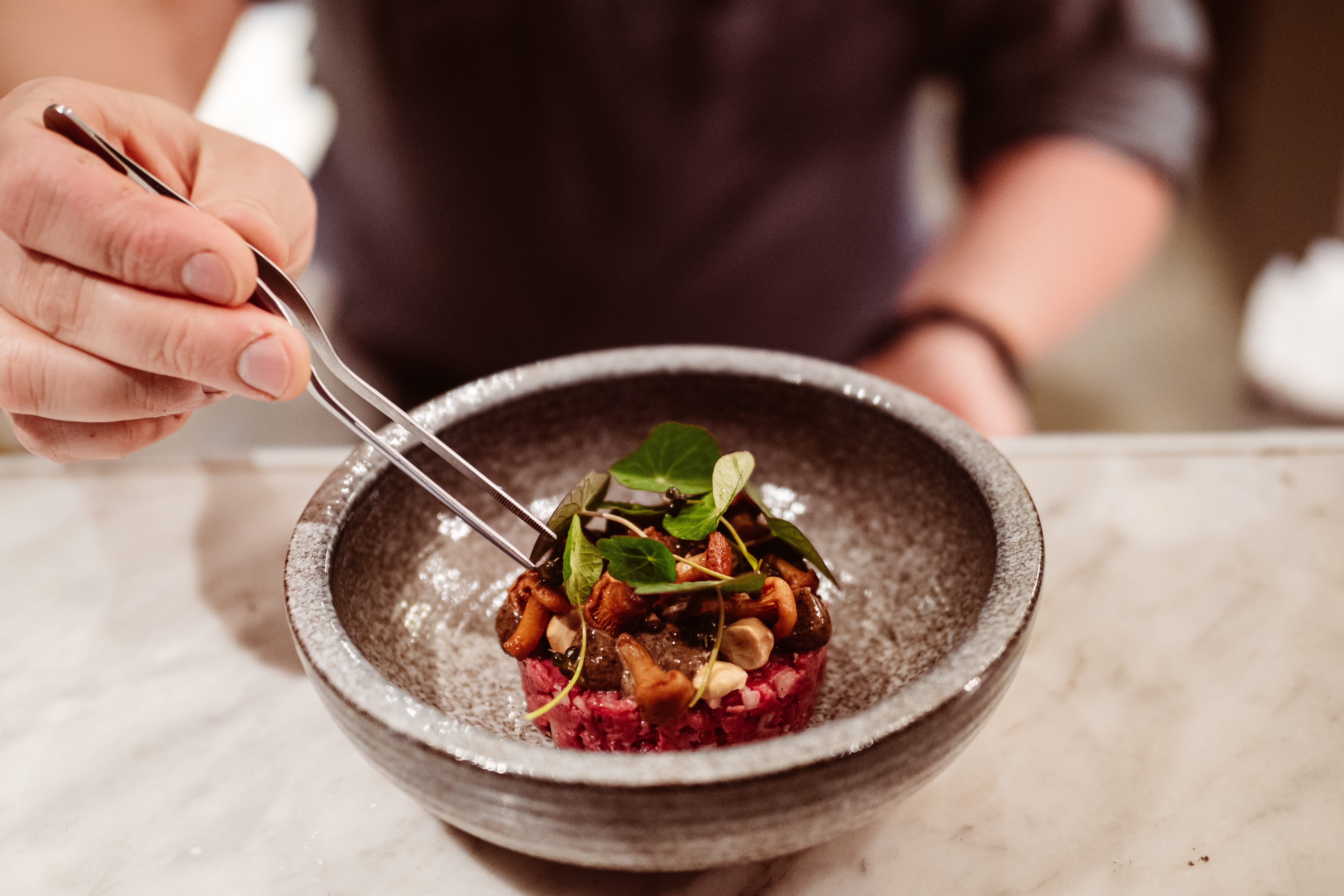 A person eats a luxorious dish