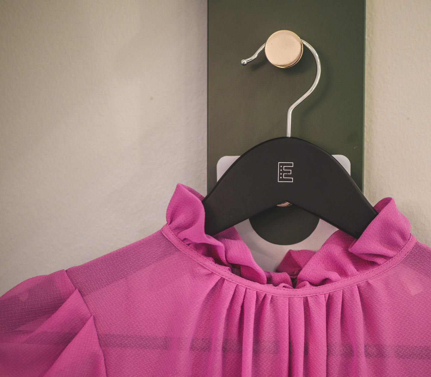 Pink dress hanging on a hanger