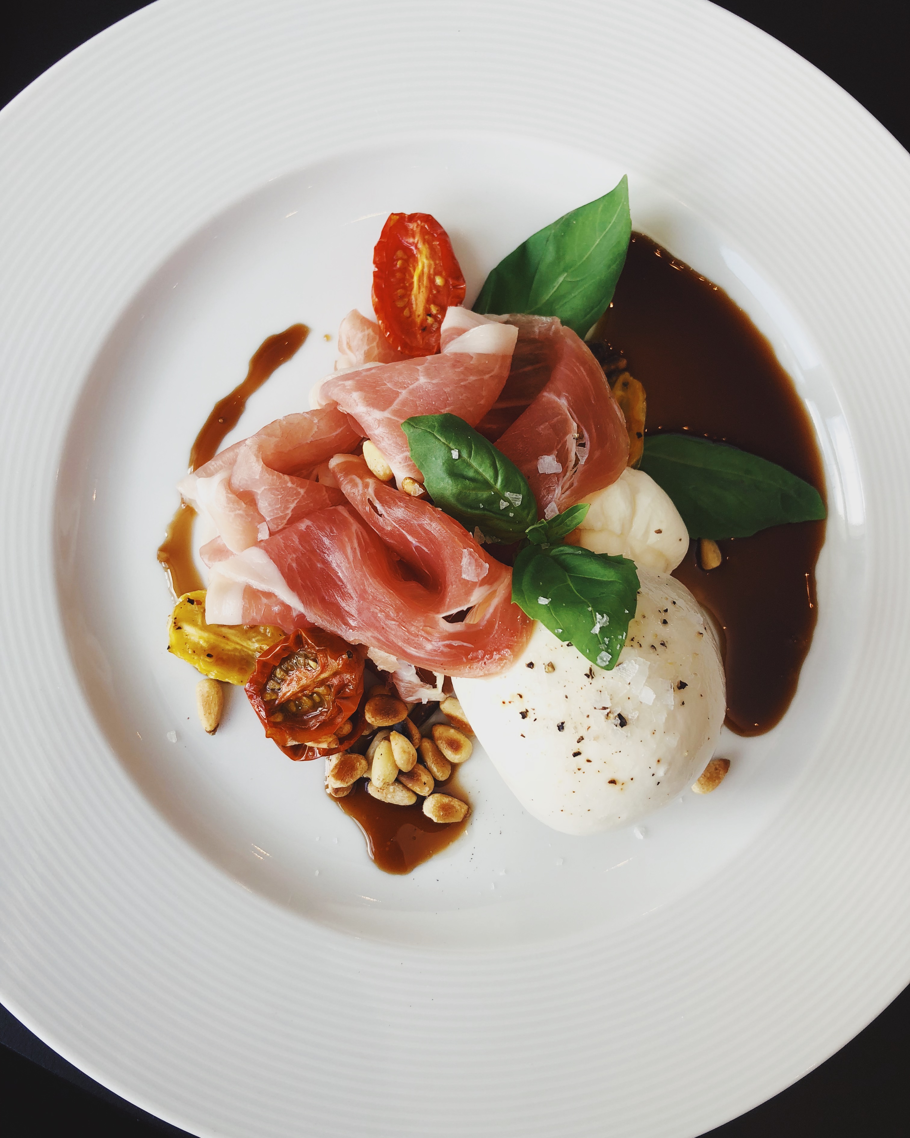 Appetizer with prosciutto and mozzarella cheese