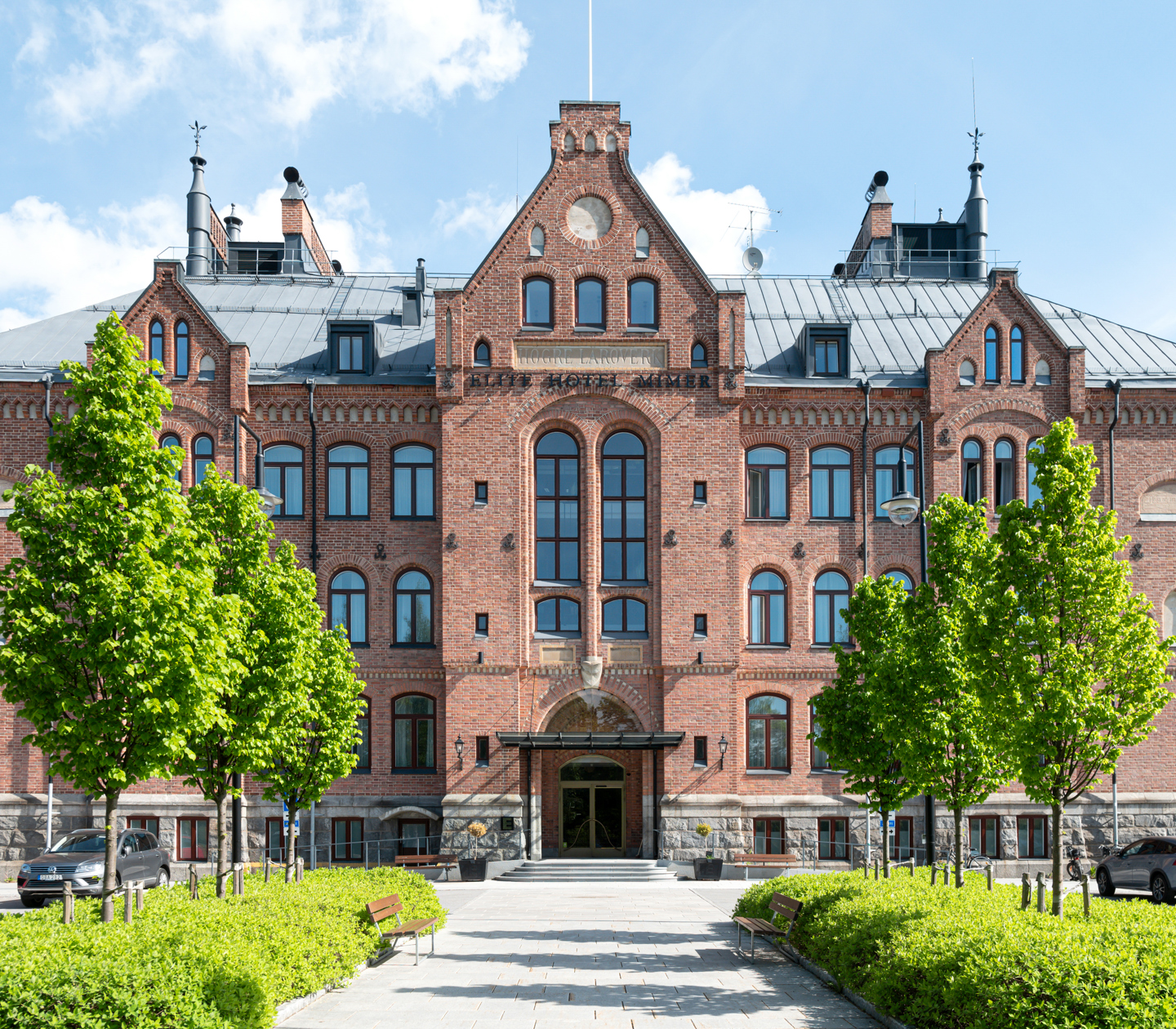 A large castle building in brown-red brick