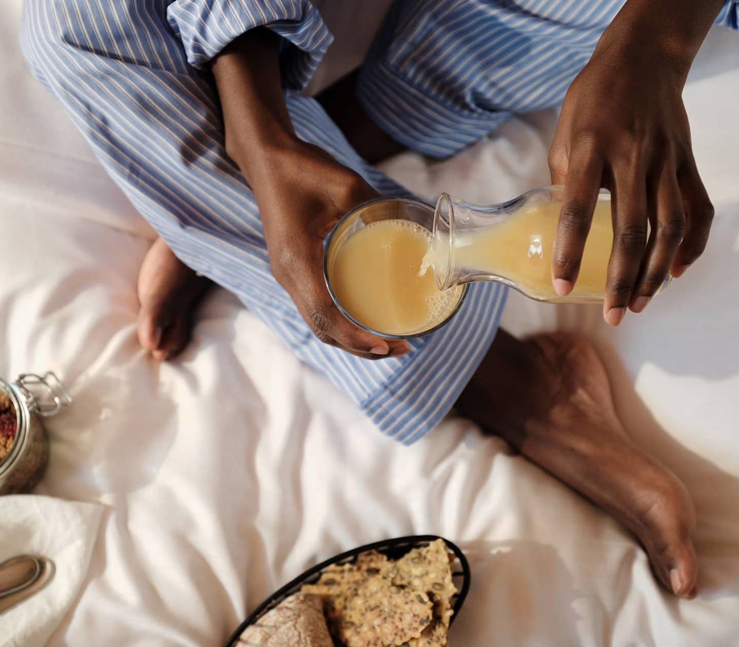 Woman in a bed having breakfast