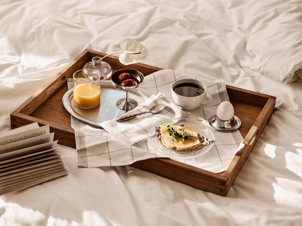 A hotel room with floral decorations and elegant furniture.