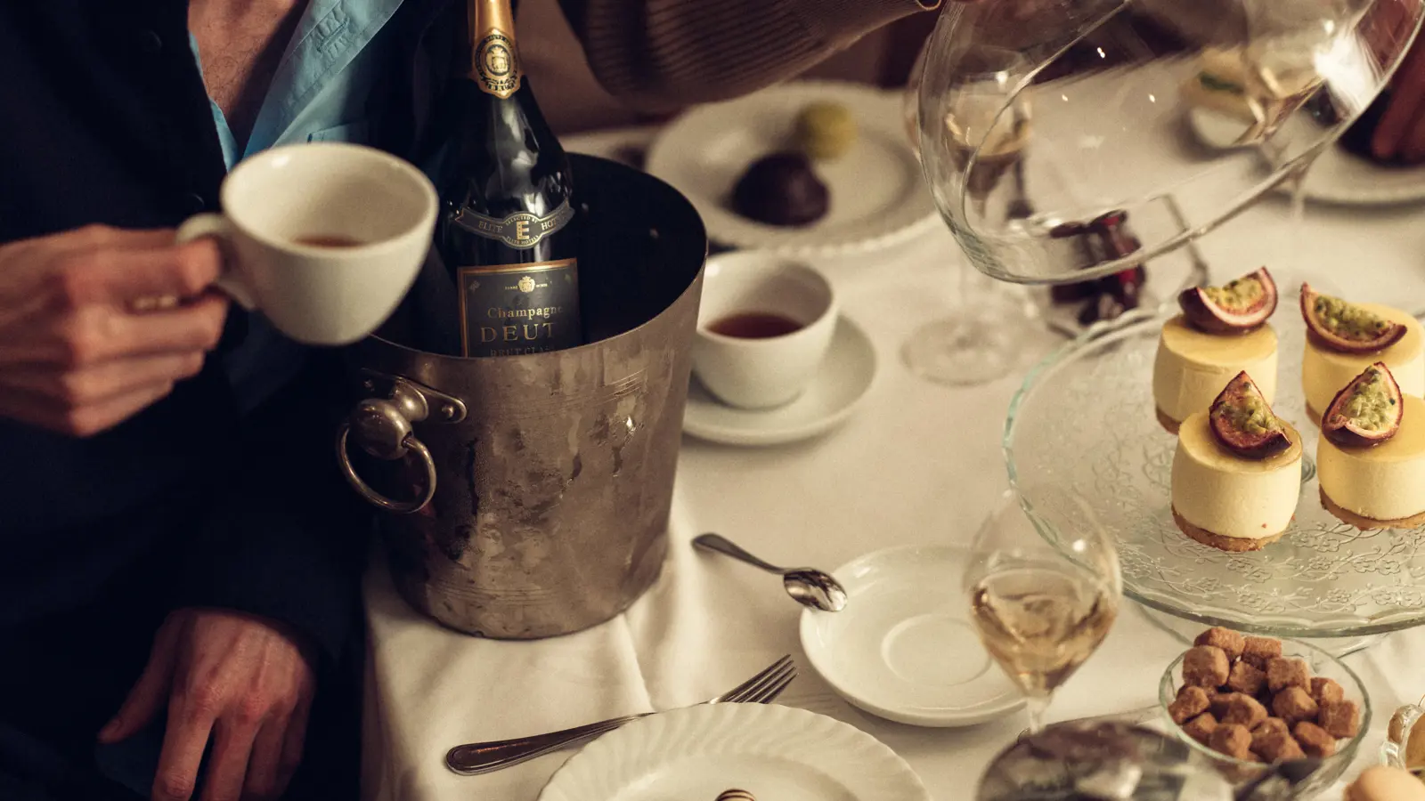 A couple is having dinner at a beautifully set table