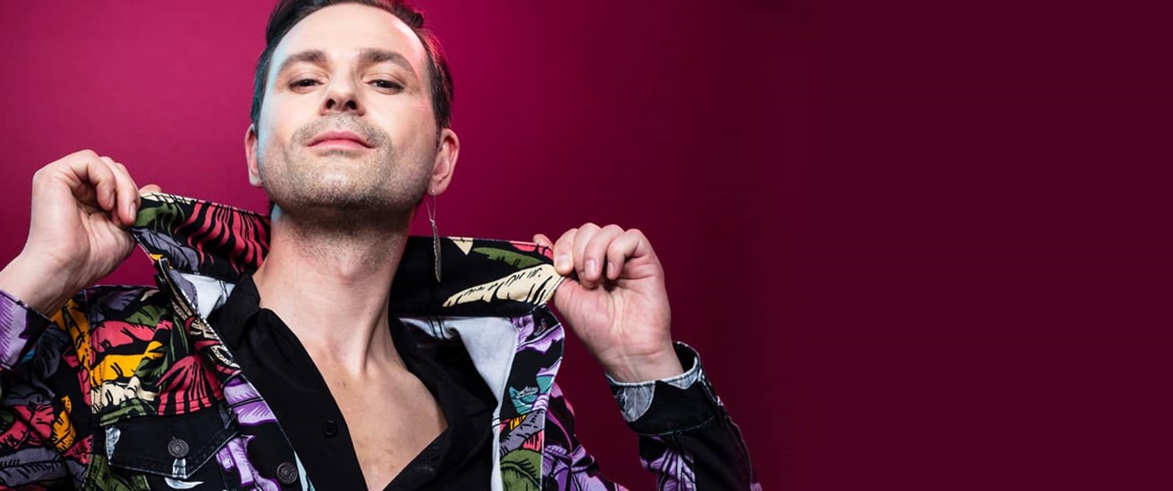 Ola Salo with a wine red background