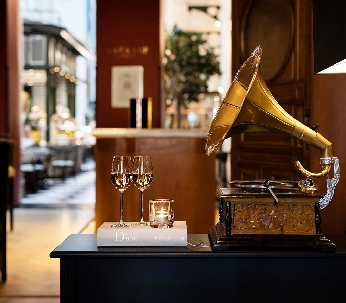 Two champagne glasses and a gramophone player