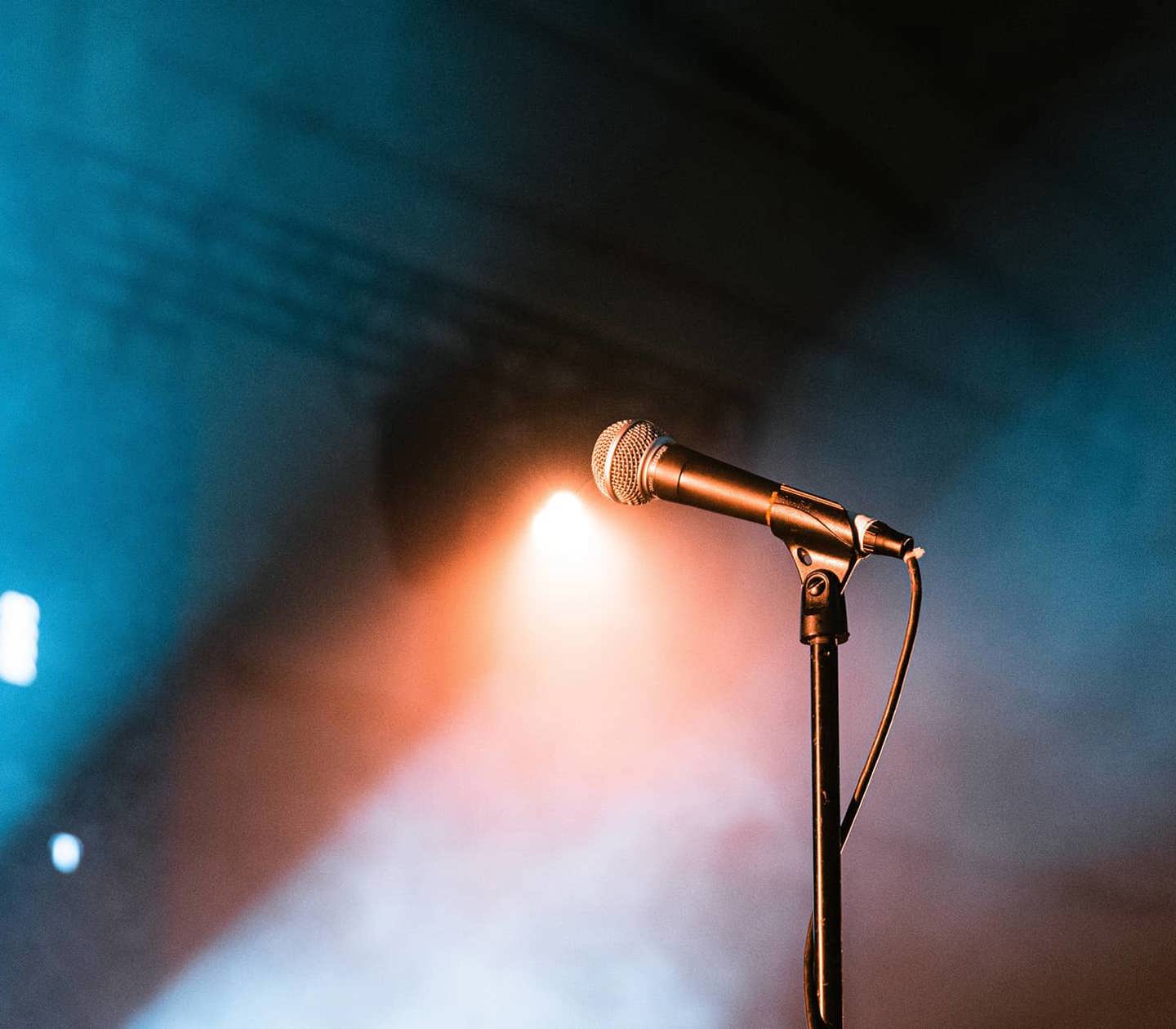 A microphone on a smoky stage