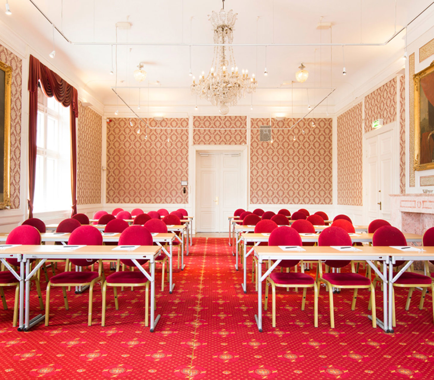 A large and elegant conference with red interior and details