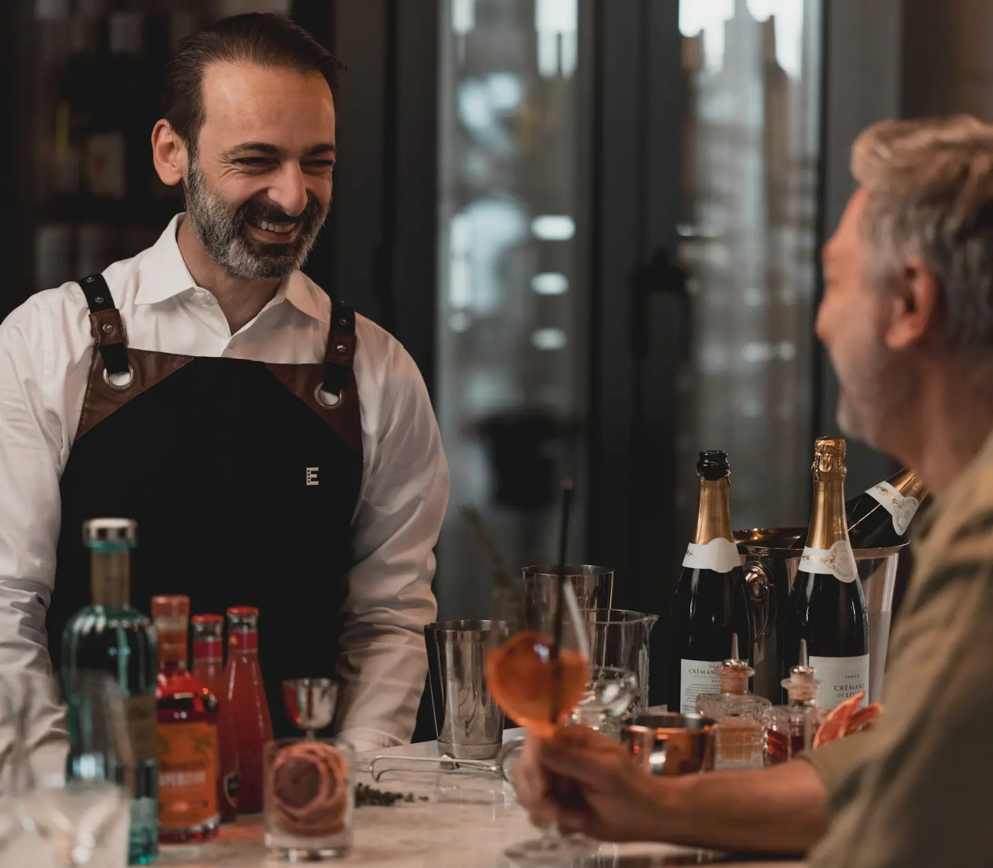 Chefs in a commercial kitchen preparing gourmet dishes.