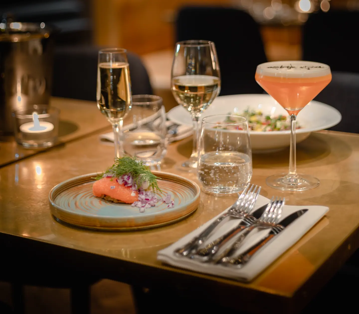 Dinner served on tables with filled glasses in front