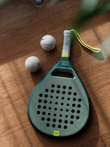 Padel racket and two balls