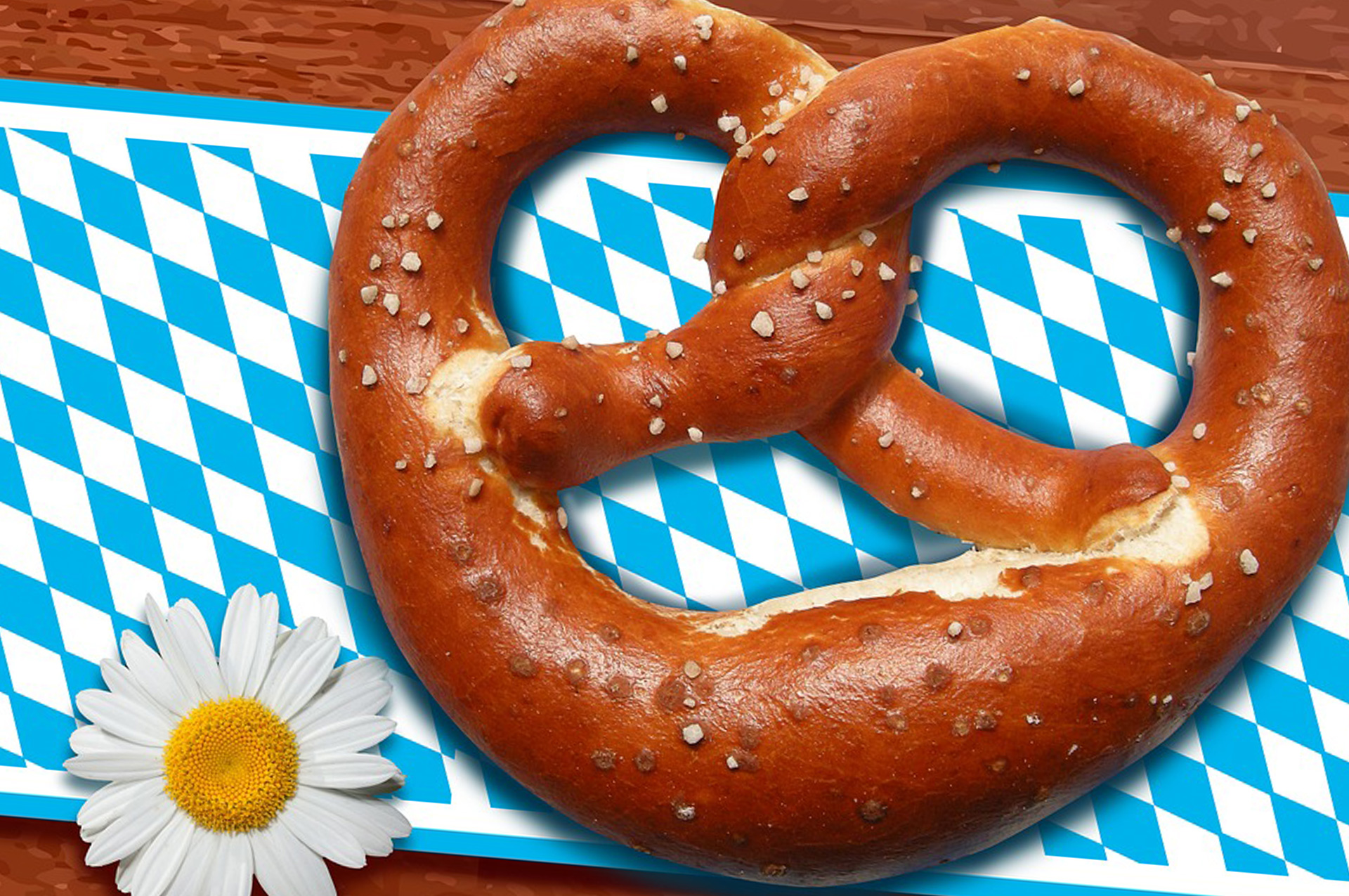 Pretzel lying on a blue and white cloth