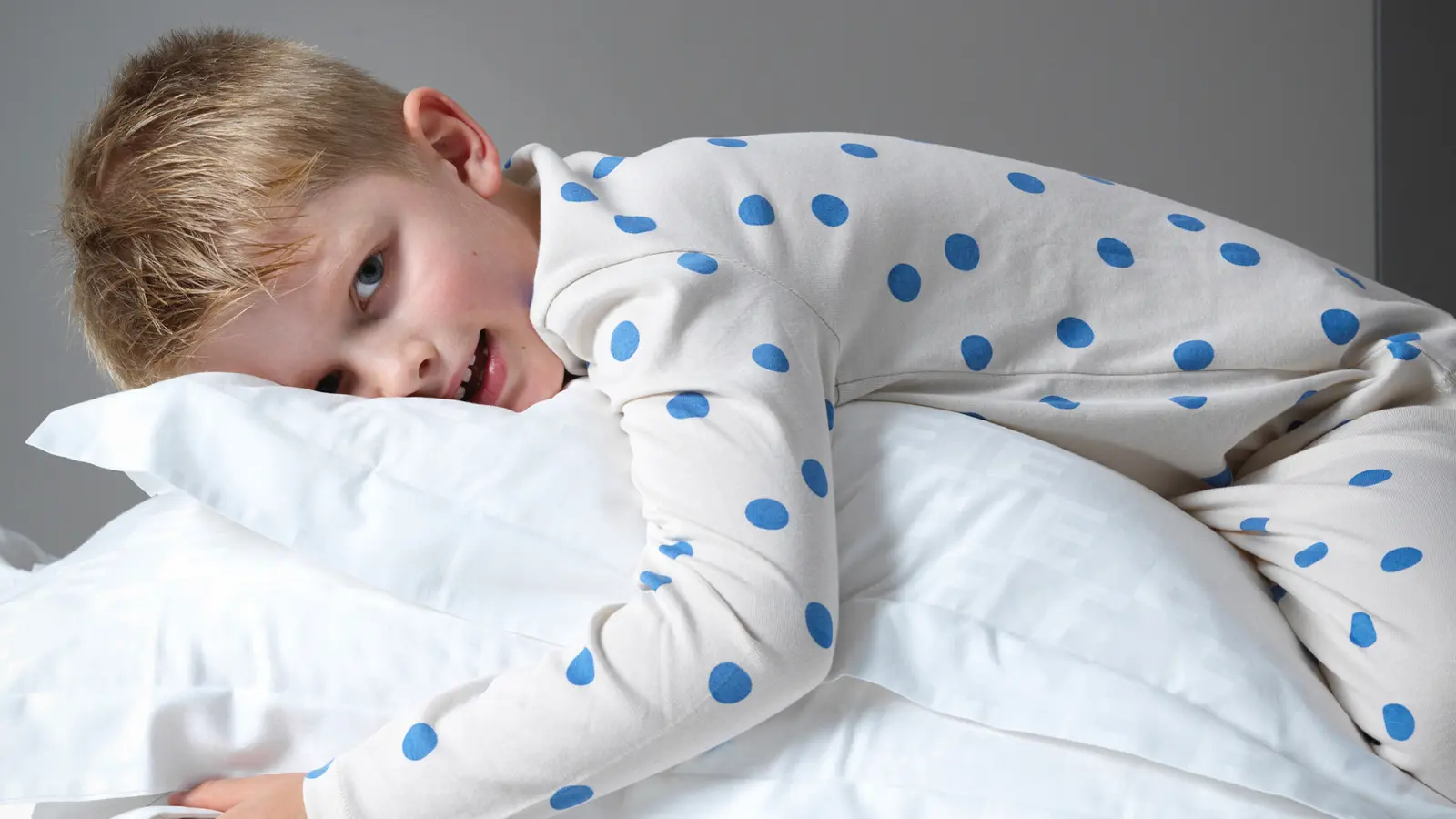 Boy lying on a pillow