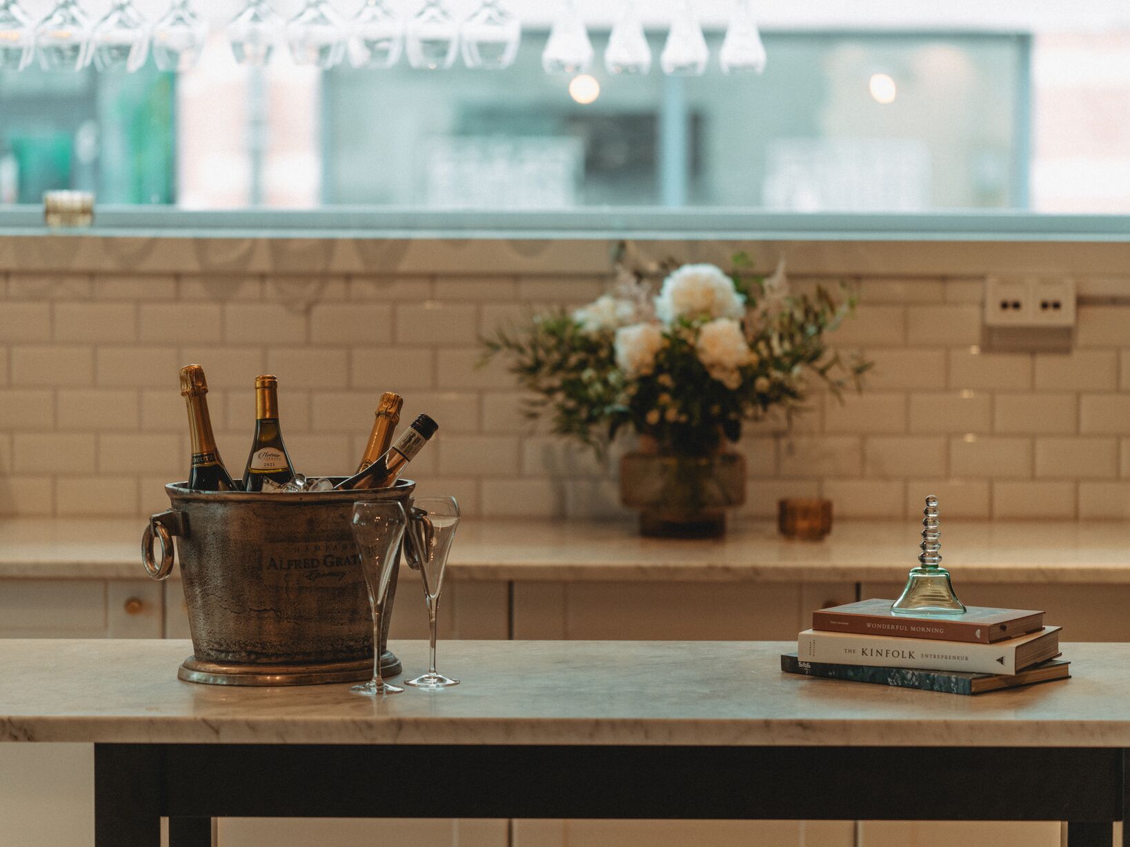 A bar with bottles in a champagne bucket.