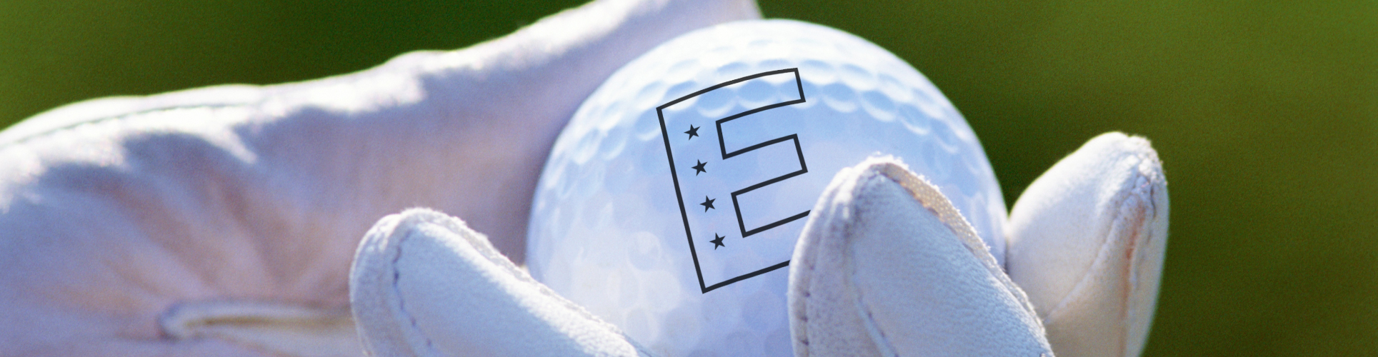 Hand holding a golf ball