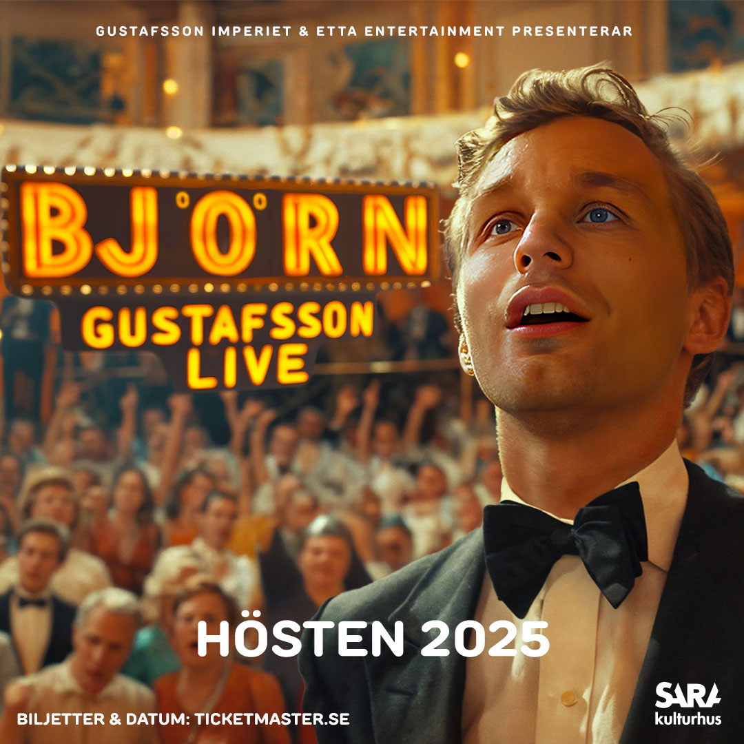 Björn Gustafsson på en scen framför publik