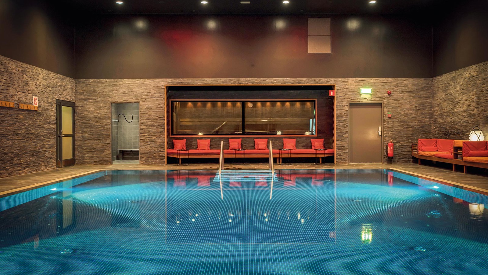 A large indoor pool in subdued lighting