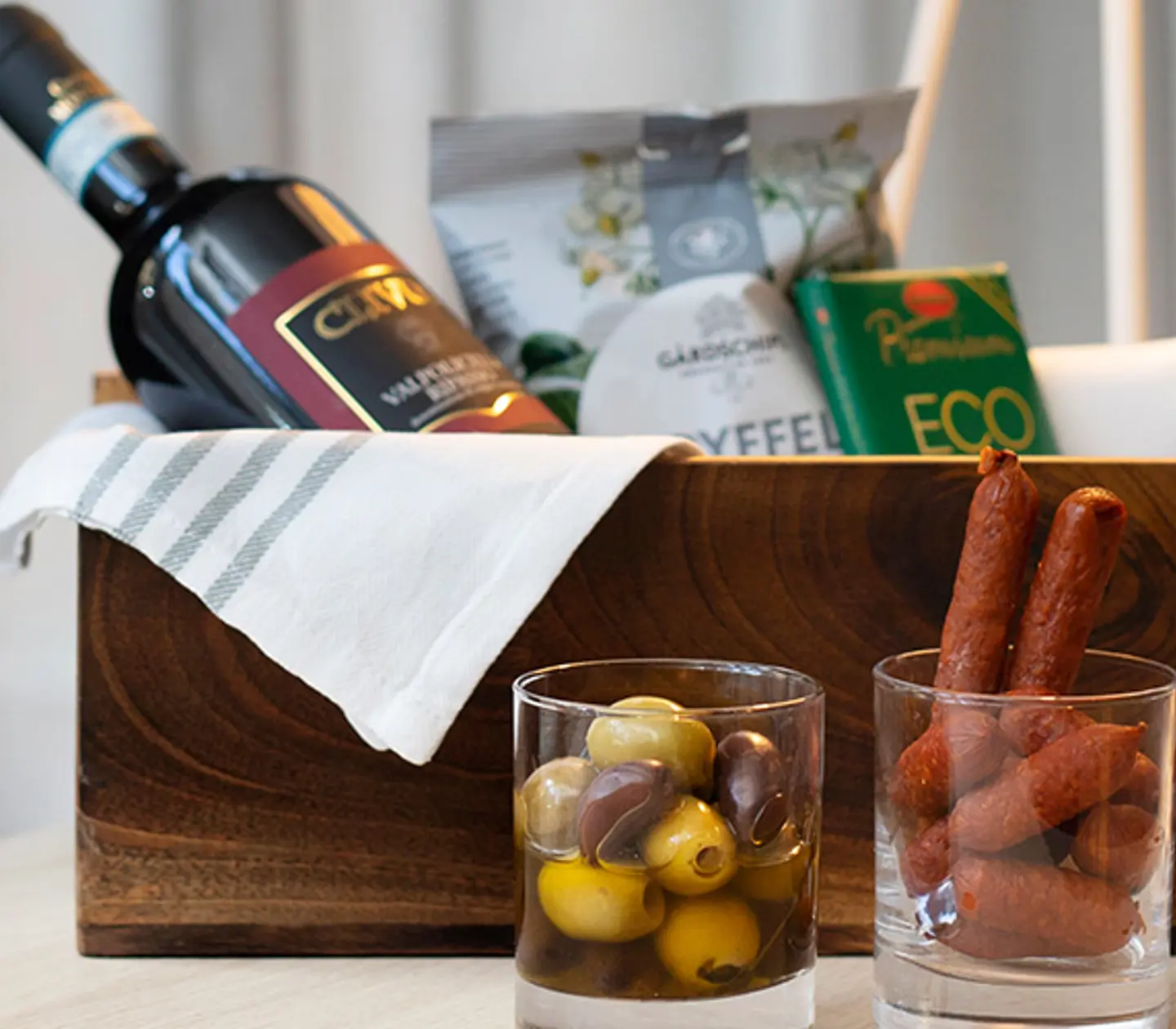 Box of delicacies on hotel bed