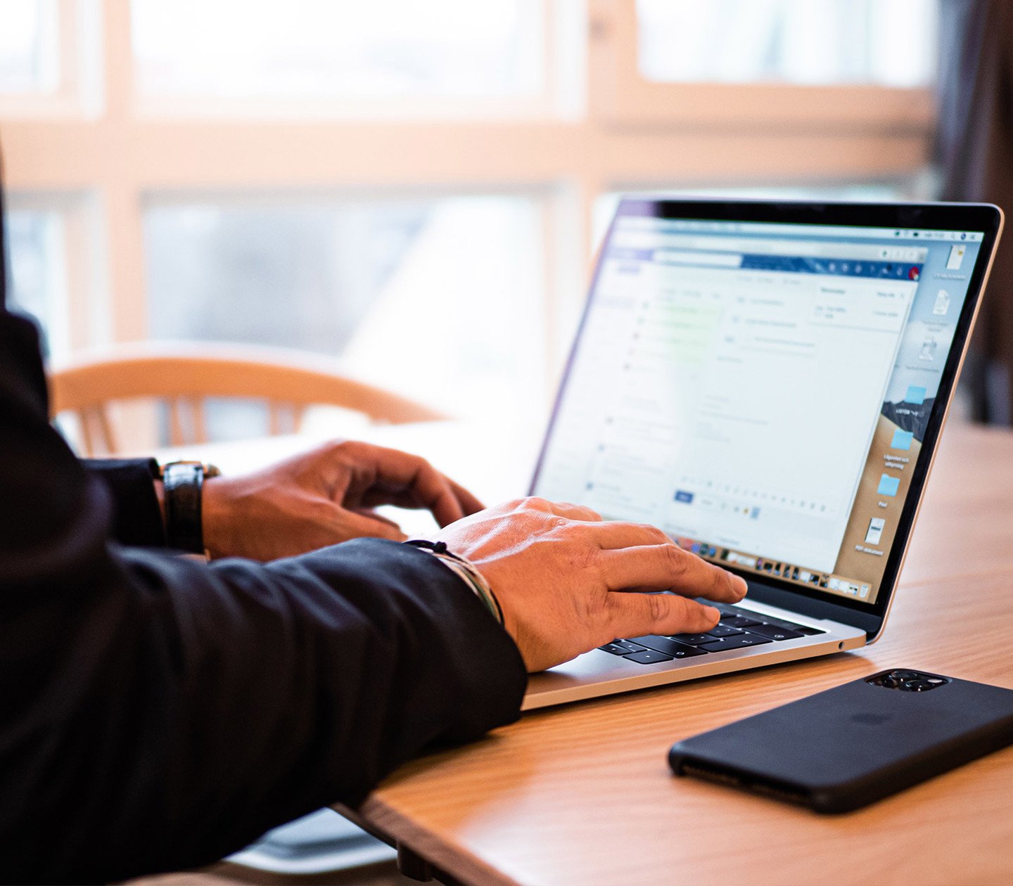 A person writing on a computer