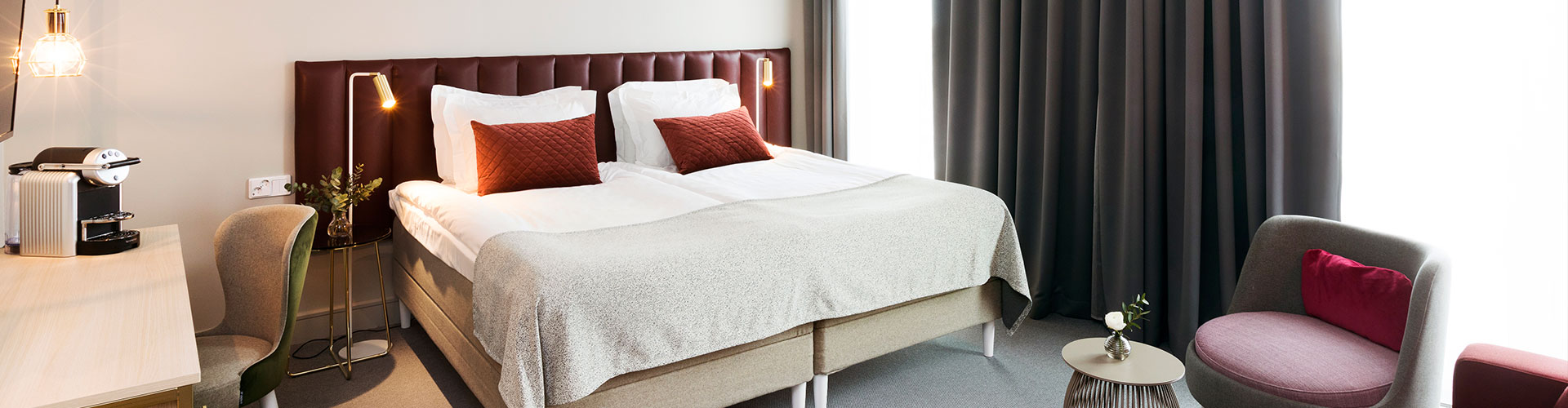 Hotel room with made bed