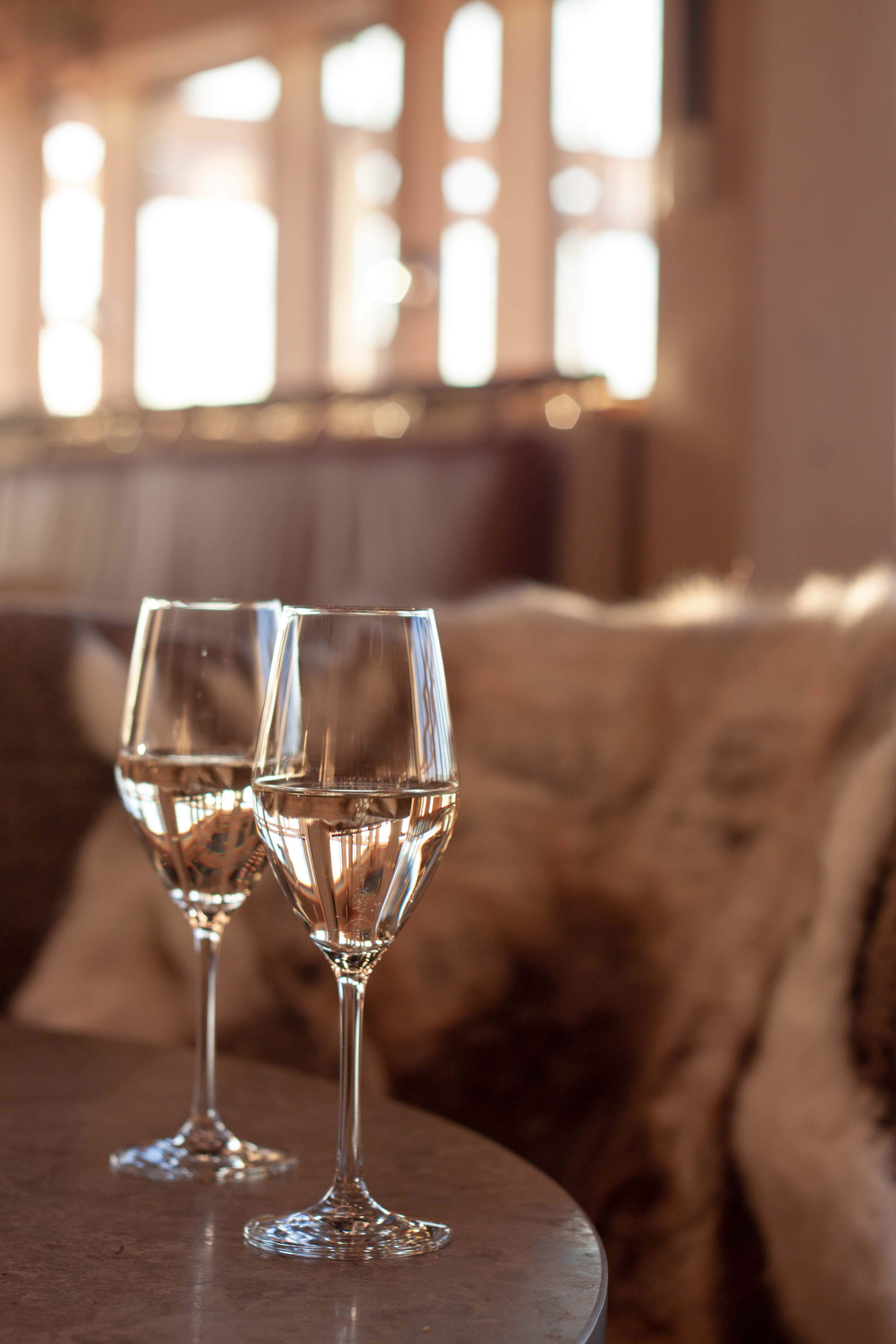 Basket with bottled wine and delicacies