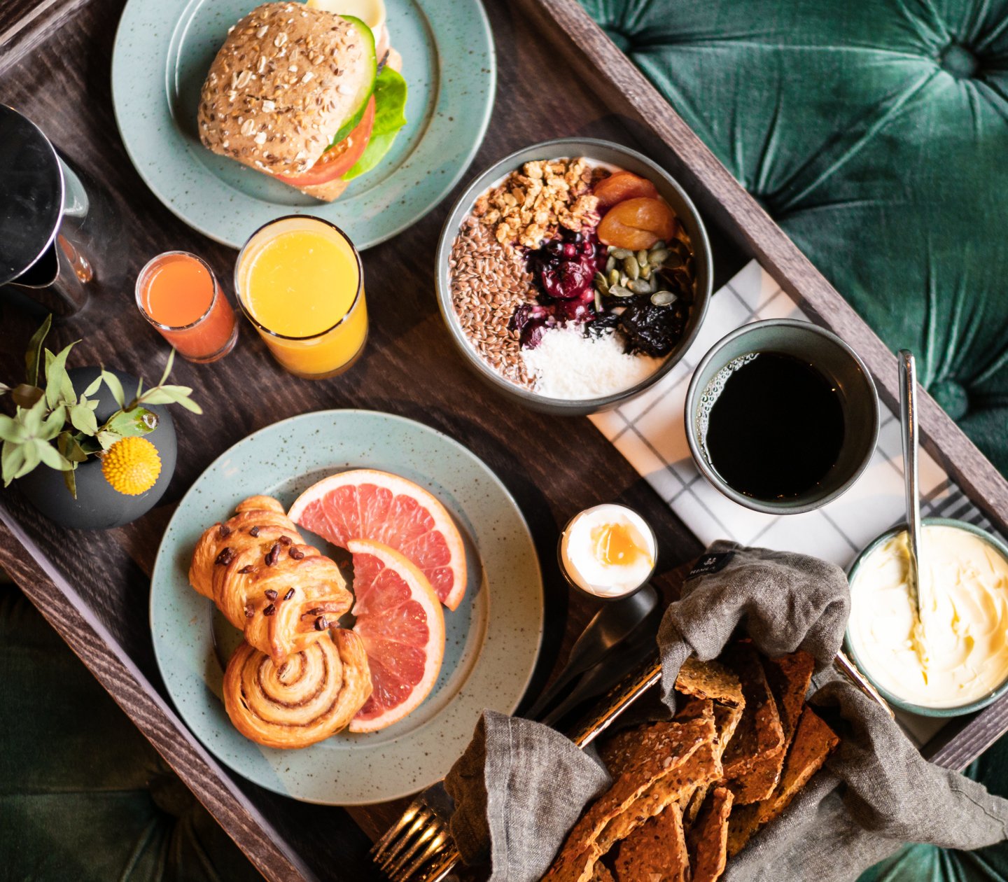 Breakfast tray laid out against a green background