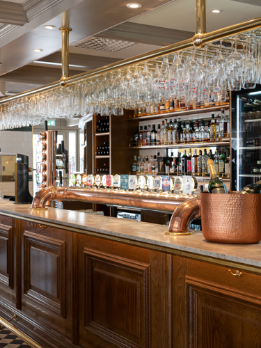 Bar with beer taps and bottles