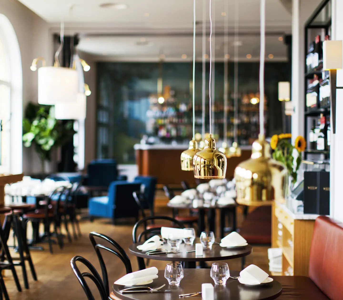 Cozy restaurant environment with set tables and nice lamps