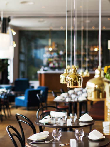 Cozy restaurant environment with set tables and nice lamps