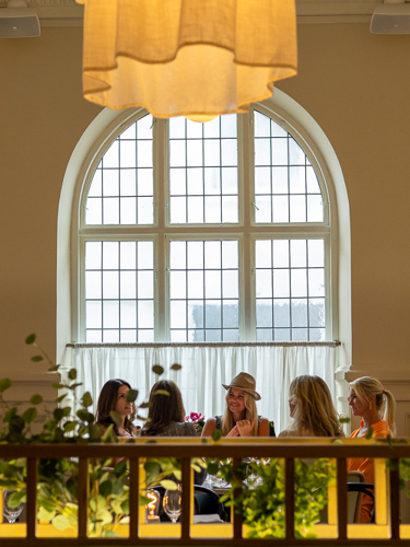 Several women sitting around dinner table