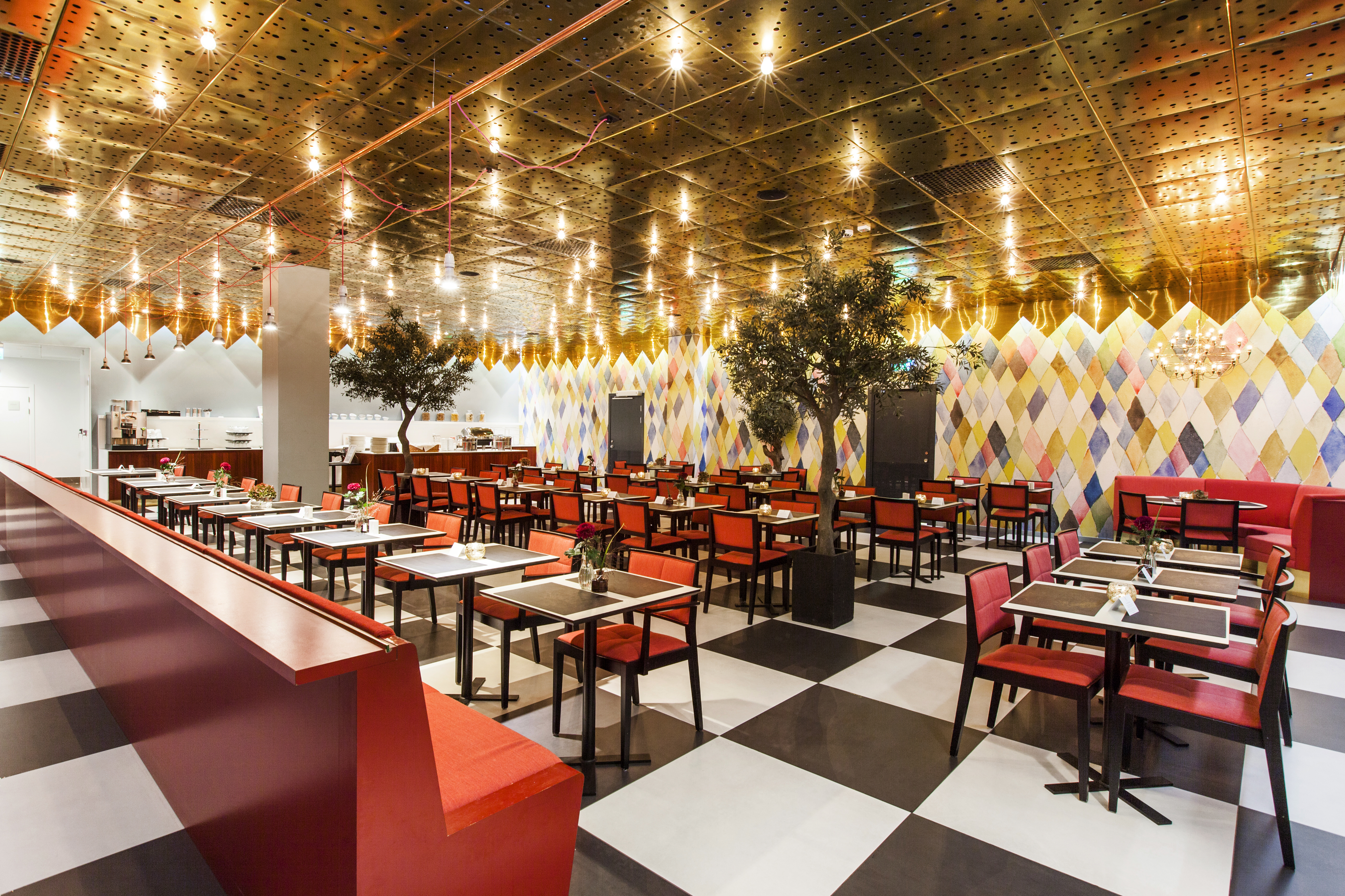 Restaurant with red chairs and checkerboard floor
