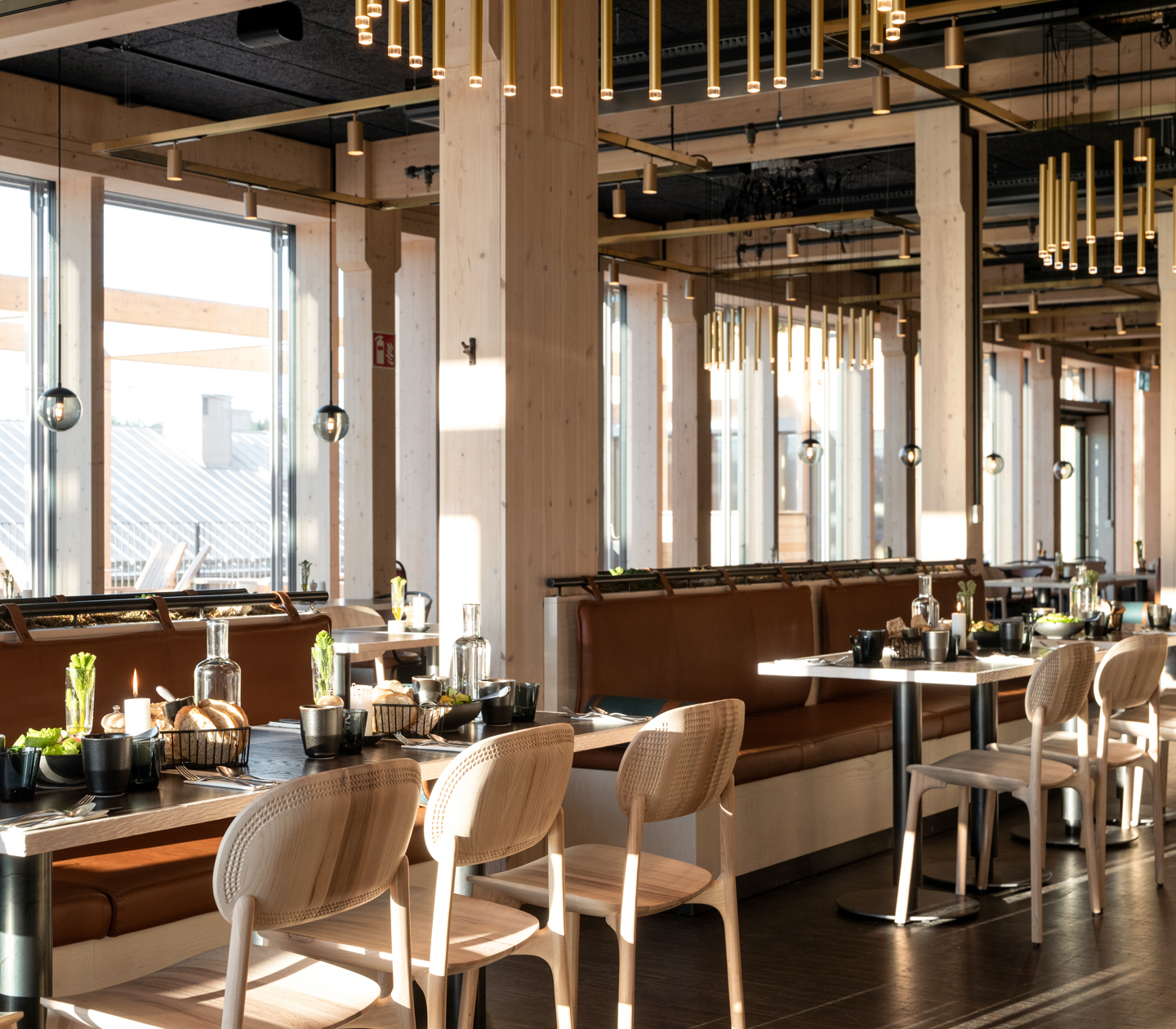 A modern restaurant with several elements of wood in the interior