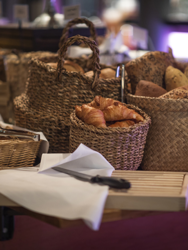 Several baskets of breakfast bread