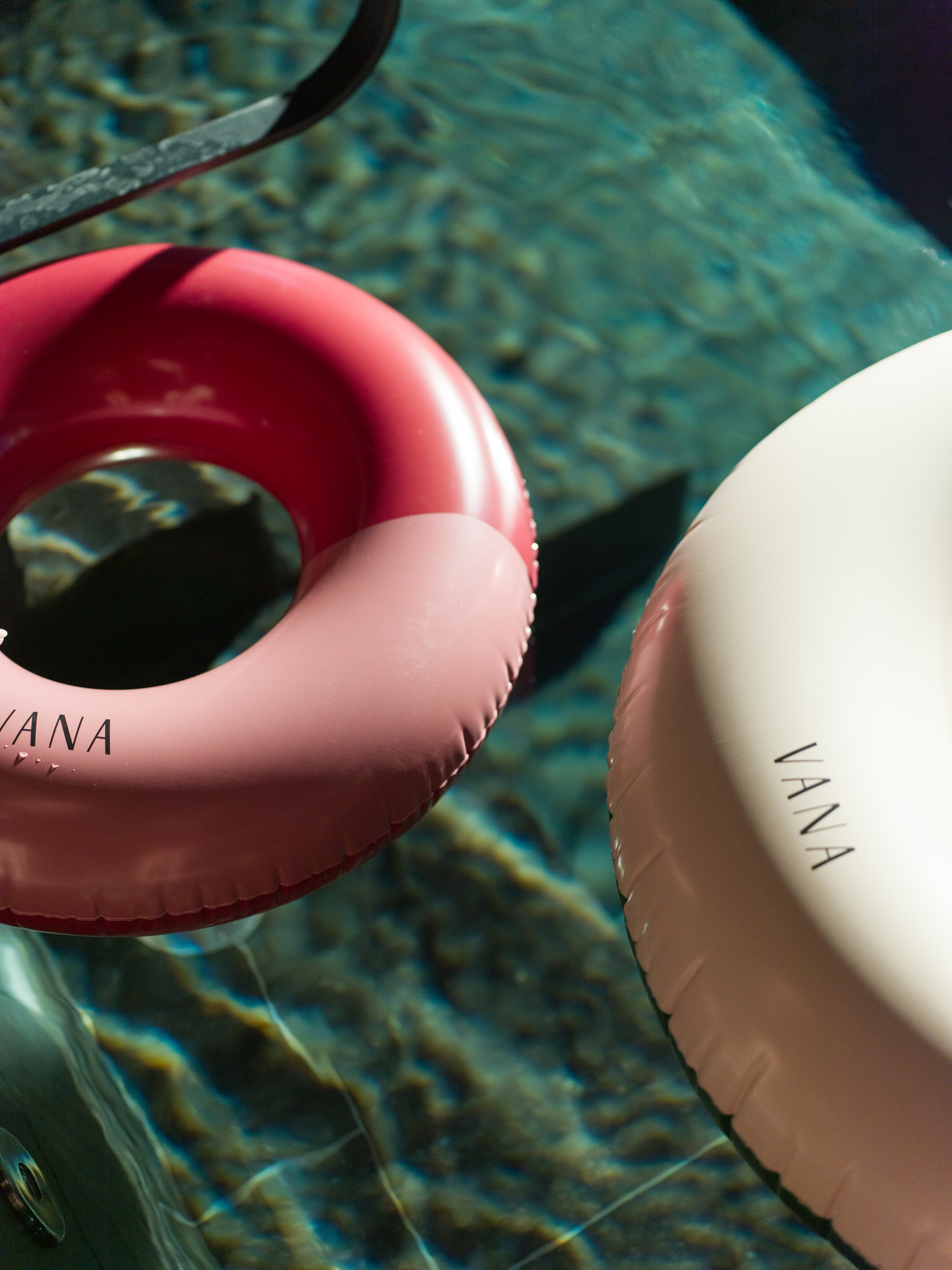 Woman in outdoor pool blocking outwards