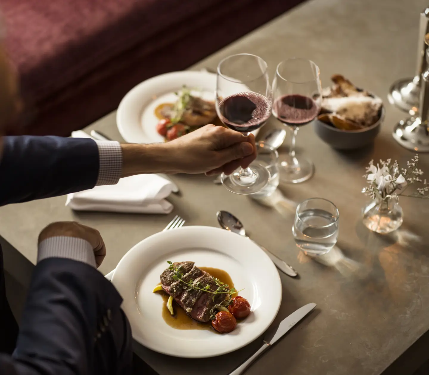 Dinner table with food and wine