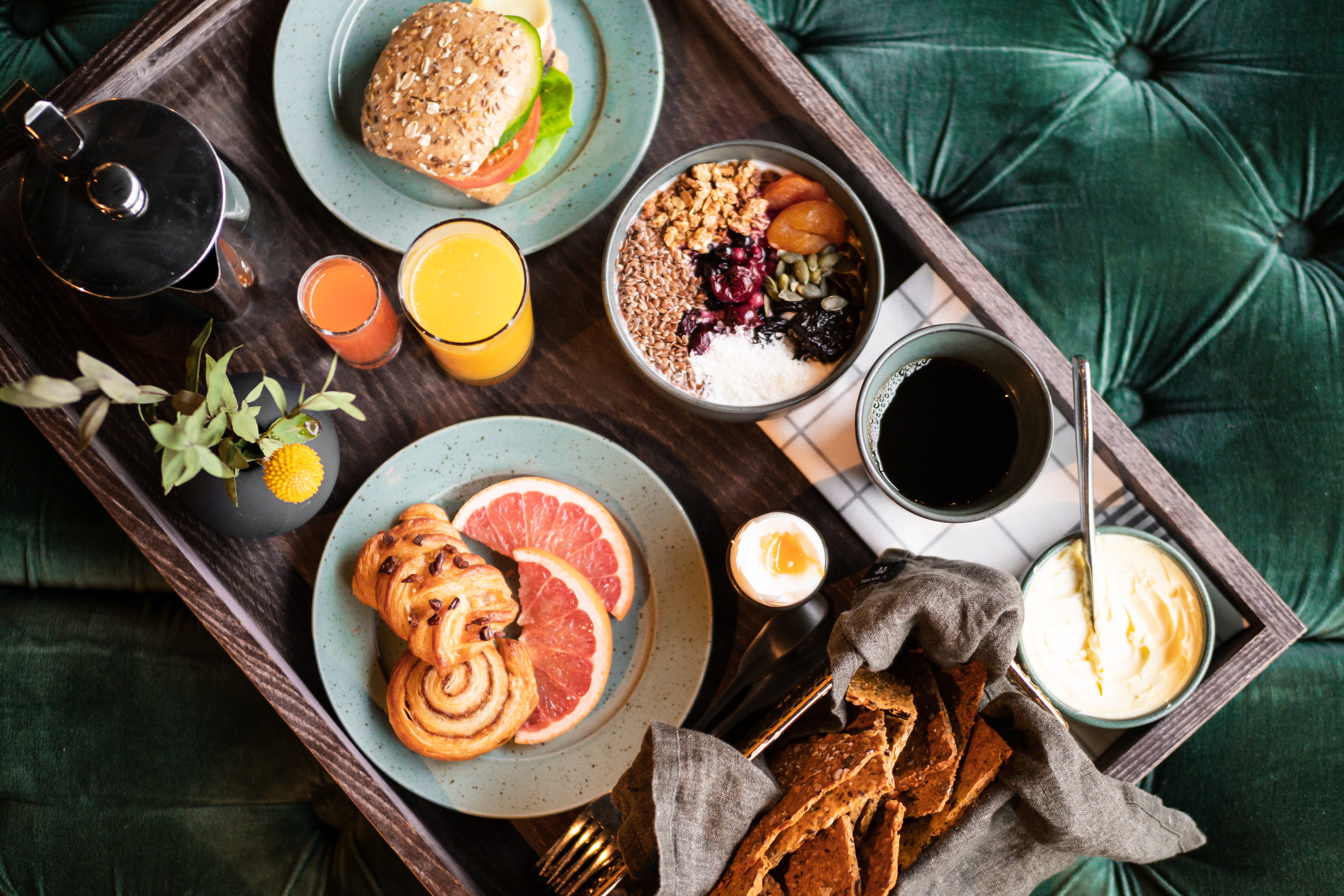 Breakfast tray laid out against a green background